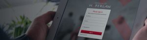 Person holding iPad while on the HyperLaw login screen